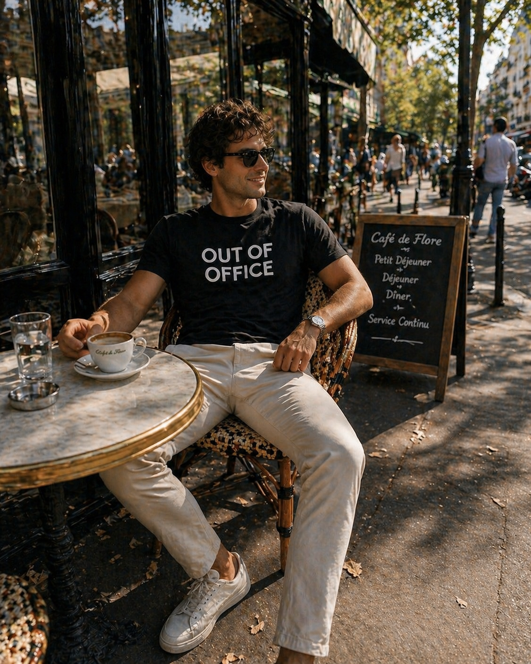 Men's black Out of Office graphic t-shirt by Leisurist with umbrella logo on sleeve
