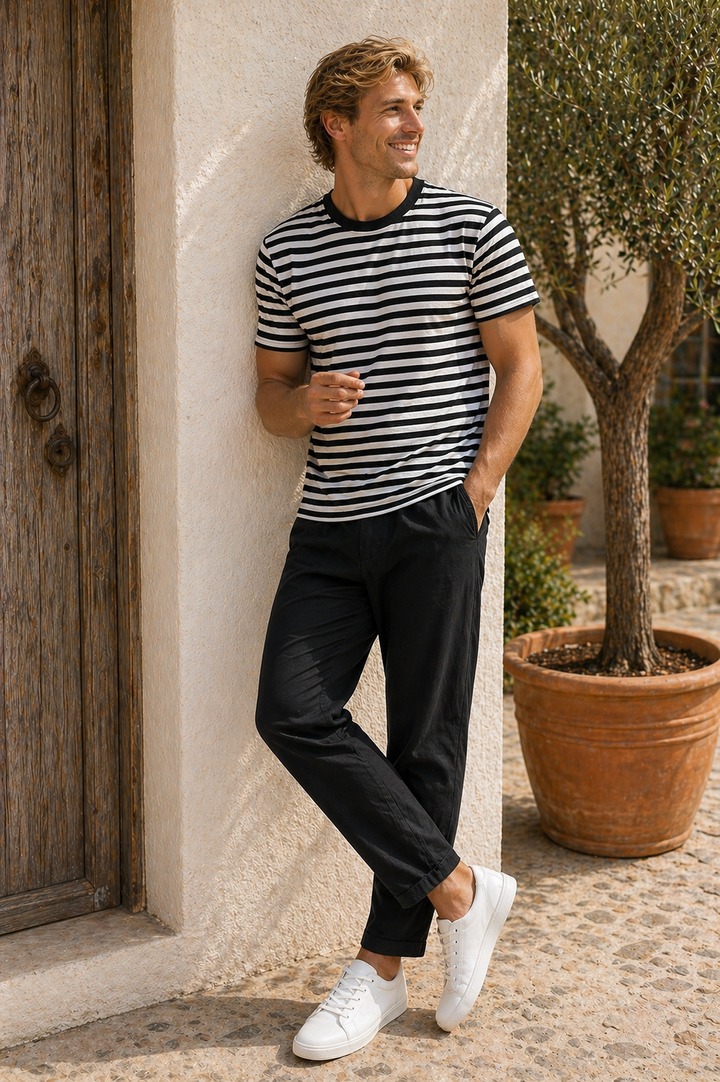 Men's black and white striped Riviera graphic t-shirt by Leisurist with umbrella logo on sleeve